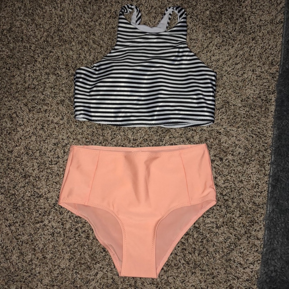 High neck swimsuit top and high waisted bottoms.